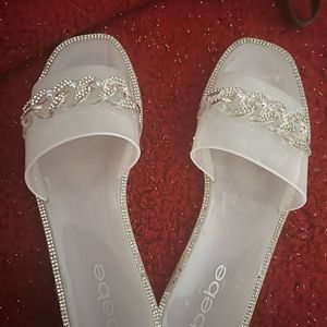 BeBe slides with a bit of bling. One for a half hour perfect condition like new